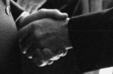 Detail of photograph of h和shake between 莱弗里特·索尔顿斯托尔和林登·约翰逊 at the White House